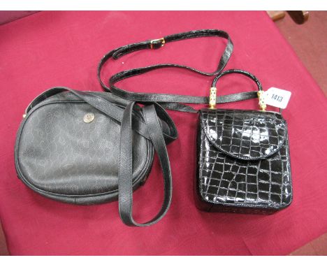 Dior; A Vintage Black Logo Print Shoulder Bag, with black leather strap and zip closure to top; A Black Patent Croc Effect Ha