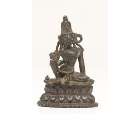 Bronze with silver and copper inlaysTibet, 12th centuryDimensions: Height 6,5 cmWeight: 74 gramsA Bodhisattva seated in royal