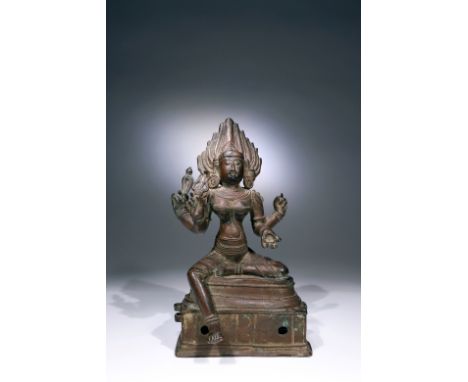 BronzeIndia, 18th century or earlierDimensions: Height 25 cmWeight: 2.625 gramsA four-armed Kali goddess is seated leisurely 