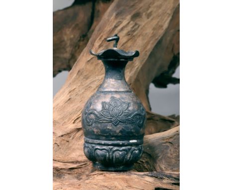 SilverChina, Five Dynasties (907 - 960)Dimensions: Height 7,8 cm Bore 1,6 cmWeight: 61 gramsSmall bottle with tiny foot. The 