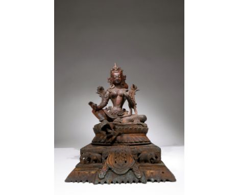 BronzeTibet, 18th centuryDimensions: Height 30 cmWeight: 4.033 gramsThis Tara deity is seated in the royal ease pose on a lar