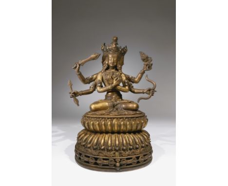 Bronze rest-gilt with stone inlaysSino-Tibetan, 19th centuryDimensions: Height 29 cmWeight: 3660 gramsThis six-armed, three-h