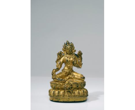 Gilt bronzeChina, Ming Dynasty, Yong Le mark (1403 - 1424)Dimensions: Height 14 cm by 9 cmWeight: 597,6 gramsSeated Tara on d