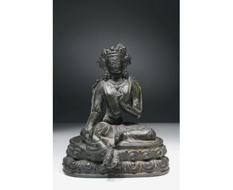 BronzeChina or Tibet, 15th centuryDimensions: Height 15 cm by 12,5 cmWeight: 880 gramsA friendly looking Green Tara seated on