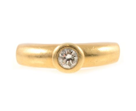 A diamond single stone ring, the brilliant cut stone collet set in an all yellow metal mount marked 750, angular shank, 6.7gm