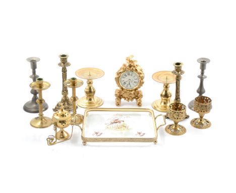A pair of brass candlesticks, wide circular foot and sconce, 13cm; other brass and pewter candlesticks; a twin-handled brass 
