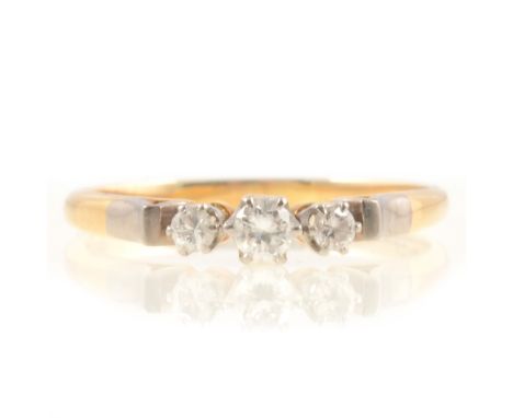 Diamond three stone ring, the brilliant cut stones claw set in a yellow and white metal mount marked 18ct, ring size U, total