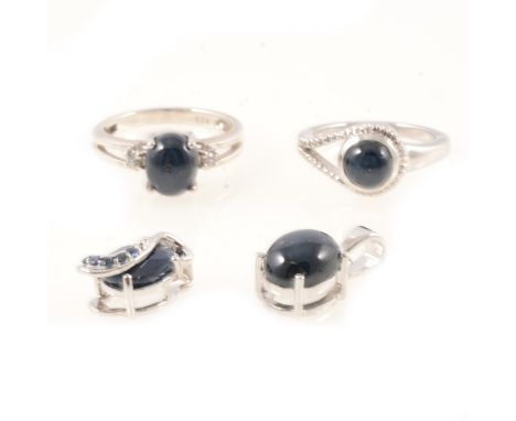 Gemporia - A star sapphire and white zircon ring, the oval cut star sapphire 9x7mm claw set, 3.090 carats, with a round cut w