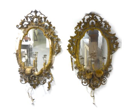Pair of three-light mirrored girandoles/ pier glasses, 19th century, the shaped plates enclosed by giltwood and scrolling ges