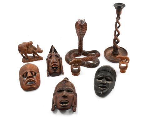 A Victorian mahogany novelty snuff box, designed as a shoe, 5.5cm x 14cm; an Indonesian carved wood group, of a figure and bu