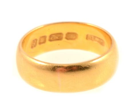 22 carat yellow gold wedding band. 5.8mm wide plain polished half D shape, London 1961, 5.9gm, ring size K.