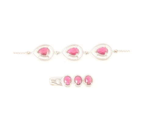 Gemporia - A Malagasy ruby bracelet, the three pear cut Malagasy rubies 7mm x 5mm claw set, with pear shape halo, total 2.250