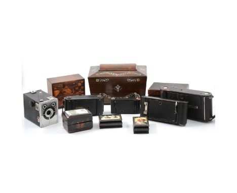 A Japanese parquetry miniature chest, 15cm; Japanese lacquered box; wood and mother-of-pearl tea caddy; folding and box camer