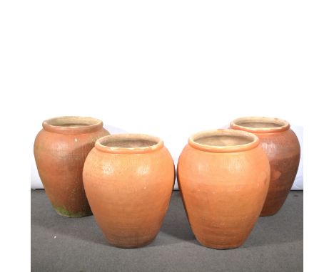 Four large Ali-Baba garden planters, aperture 41cm diameter, height 77cm.