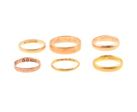 Six yellow metal and gold band rings, 22 carat yellow gold wedding band, 3.6mm wide plain polished D shape, Birmingham 1932, 