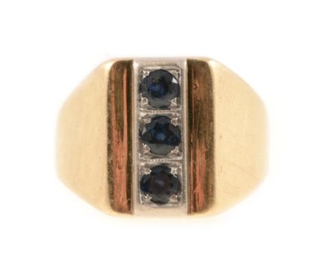 Yellow metal signet ring marked 585 vertically set with three sapphires in white setting, 8.3gm, ring size Q.