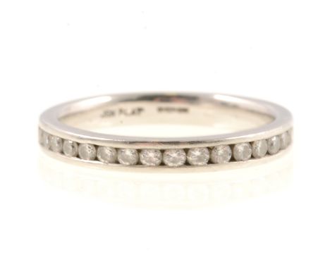 A diamond half eternity ring, twenty round brilliant cut diamonds channel set in a 3mm wide platinum mount, gross weight 4.2g