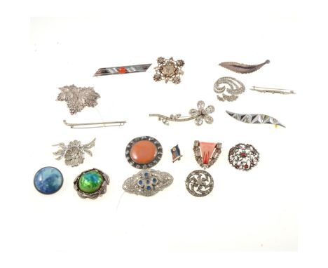 A white metal and paste set circular brooch, marked '925', 33mm diameter; a white metal leaf brooch, marked '925', 69mm; a rh