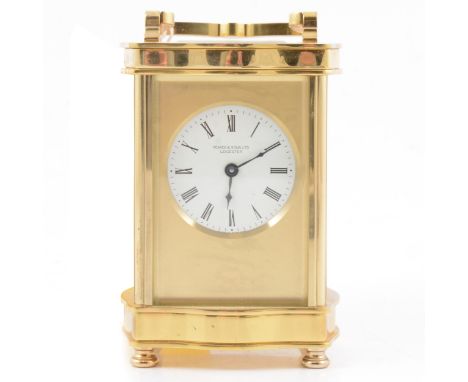 Modern brass carriage clock, serpentine case, circular dial signed Pearce &amp; Son, Leicester, non-striking movement, 13.5cm