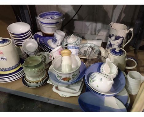 Shelf of mixed ceramics including teapots. Not available for in-house P&amp;P 