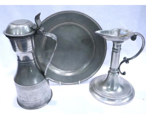 Pewter claret jug with London touchmarks and a pewter candle holder and a plate stamped 1801. P&amp;P Group 2 (£18+VAT for th