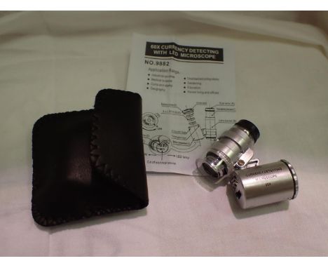 Cased 60 x magnification currency/jewellery loupe with LED light and instructions. P&amp;P Group 1 (£14+VAT for the first lot
