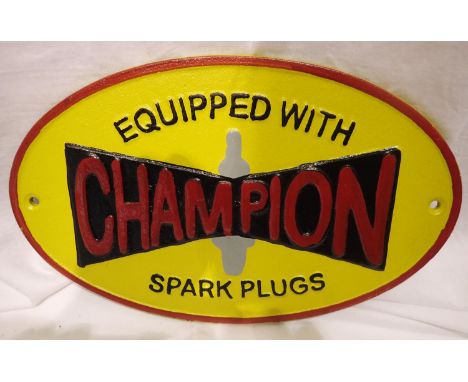 Cast iron Champion spark plugs sign, W: 27 cm. P&amp;P Group 2 (£18+VAT for the first lot and £3+VAT for subsequent lots) 