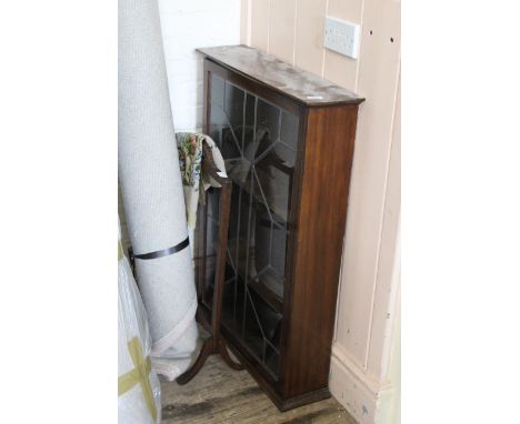 An oak and leaded glass wall cabinet, and an embroidered fire screen