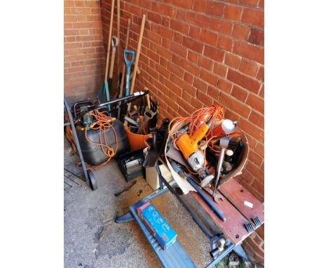 A Briggs &amp; Stratton Classic 35 petrol lawn mower, a Black and Decker hedge cutter, assorted garden and wood working tools