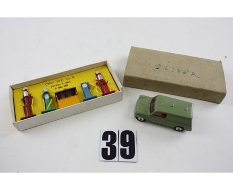 A Dinky Toys 49 Petrol Pumps Set, comprising four pumps and oil dispenser, in original box with plain card sleeve, VG, box F,