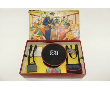 An uncommon version of a Berwick Toy Conductor Set with uniform, comprising Hat, Ticket Machine, Tickets, Conductor badge, Wh