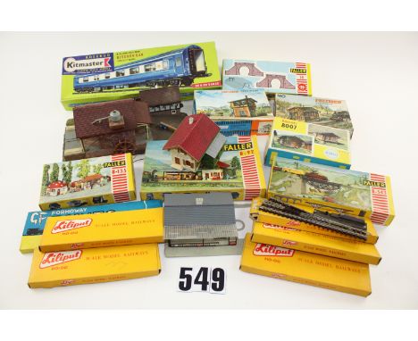 HO scale buildings and scenic items by Faller Vollmer or similar: some made up and some as unassembled kits, together with fi