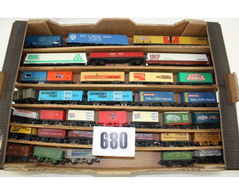 Unboxed OO/HO Gauge Freight stock by various makers: A tray containing Cargo wagons, Vans, Open Wagons, Grain Hopper and othe
