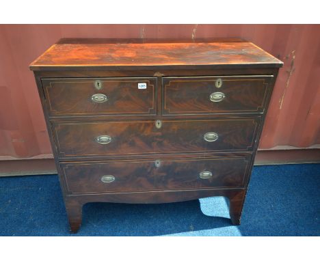 A GEORGIAN MAHOGANY AND HERRINGBONE CROSSBANDED CHEST OF TWO SHORT OVER TWO LONG DRAWERS, on high bracket feet, width 97cm x 