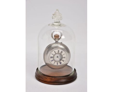 A MID VICTORIAN HALF HUNTER SILVER POCKET WATCH IN A BELL JAR GLASS DISPLAY CASE, the white face with black Roman numerals, a