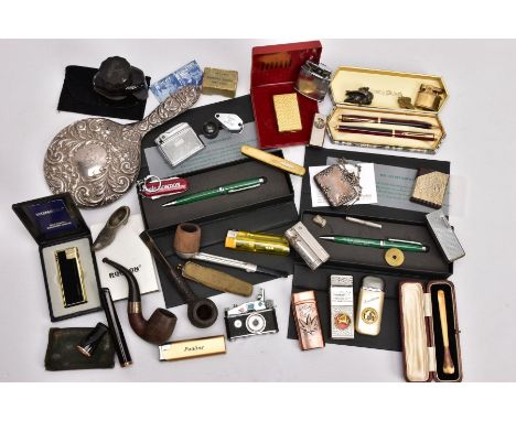 A BOX OF MAINLY PENS, LIGHTERS AND SMOKING PARAPHERNALIA, to include a cased Ronson lighter, a lighter in the form of a camer