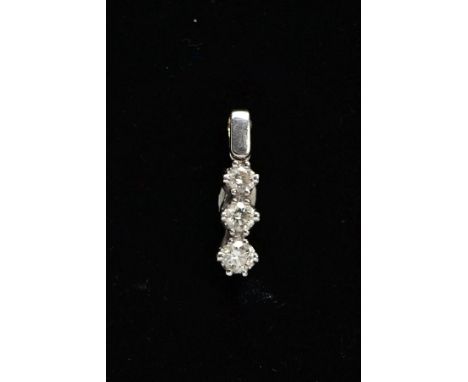 AN 18CT WHITE GOLD, DIAMOND PENDANT, designed with a row of three graduated, claw set, round brilliant cut diamonds, total es