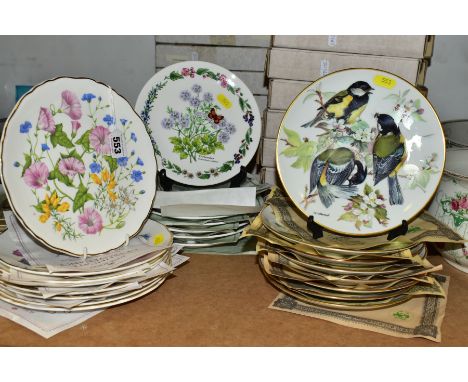 TWENTY FIVE COLLECTORS PLATES with boxes and certificates of authenticity, themes to include birds, flowers and herbs, a set 
