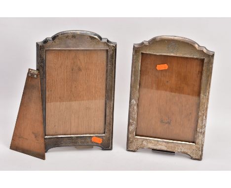TWO EARLY 20TH CENTURY SILVER PHOTOGRAPH FRAMES, both of a similar design with arched top, one with engraved monogram within 