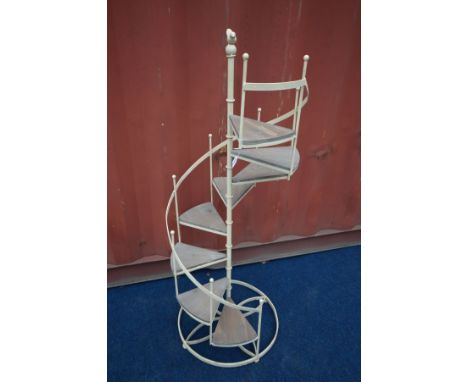 A METAL SPIRALLING STAIRCASE DISPLAY UNIT, diameter 51cm x height 134cm (the item in this lot is the remanence of a fire dama
