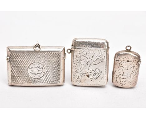 THREE SILVER VESTAS, the first of an engine turned design, engraved monogram 'Nov 5th 1878 to Nov 5th 1903', striker to the b