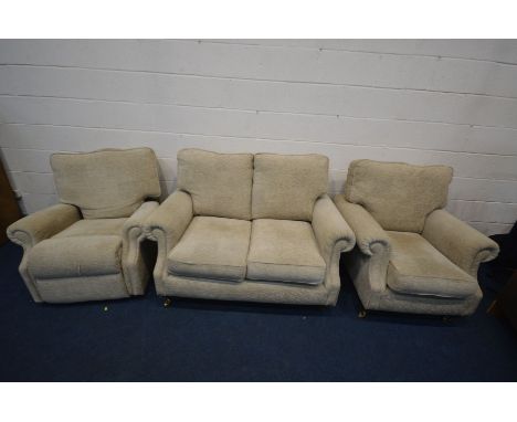 A CREAM UPHOSTERED THREE PIECE LOUNGE SUITE, comprising a two seat settee, armchair and a manual reclining armchair (3)