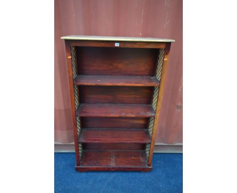 A HARDWOOD OPEN BOOKCASE with iron sides, width 90cm x depth 30cm x height 150cm (the item in this lot is the remanence of a 