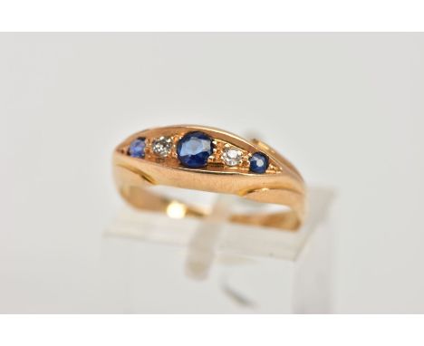 AN EARLY 20TH CENTURY, 18CT GOLD SAPPHIRE AND DIAMOND BOAT RING, set with three circular cut blue sapphires interspaced with 