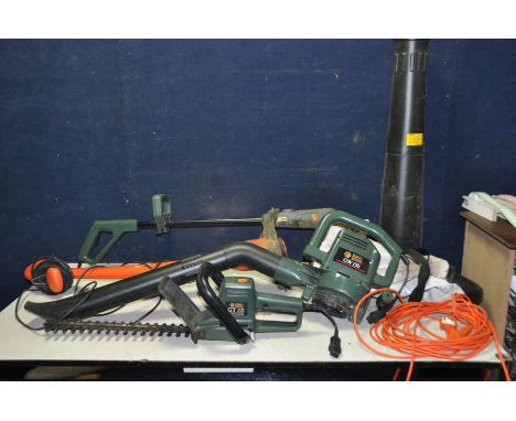 A FLYMO POWER TRIM STRIMMER and three Black and Decker garden tools with one cable comprising a GW150 Garden Vac with collect
