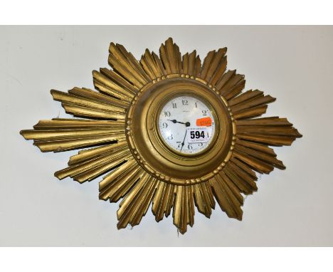 A FRENCH BAYARD EIGHT DAY SUNBURST WALL CLOCK, white enamel dial with Arabic numerals, case is of wood construction, approxim