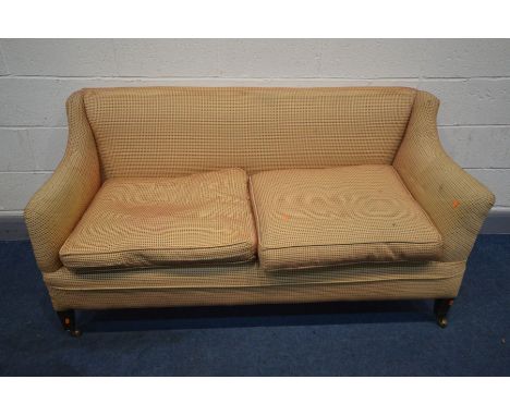 A GEORGIAN SOFA, in the manner of Howard &amp; Sons, on square tapered mahogany legs, and brass casters, width 158cm x depth 
