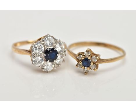 TWO 9CT YELLOW GOLD, SAPPHIRE AND CUBIC ZIRCONIA CLUSTER RINGS, the first a large cluster set with a central, circular cut bl