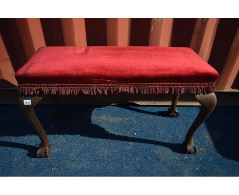 A GEORGIAN MAHOGANY DUET FOOTSTOOL, on ball and claw cabriole legs, length 99cm (the item in this lot is the remanence of a f