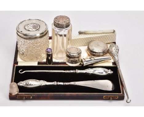 A SELECTION OF SILVERWARE, to include a cased shoe horn and boot pull set, both with embossed silver handles, silver hallmark